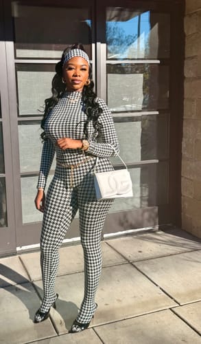 Reviewer standing outdoors wearing the Naked Print Headband with a matching houndstooth outfit.
