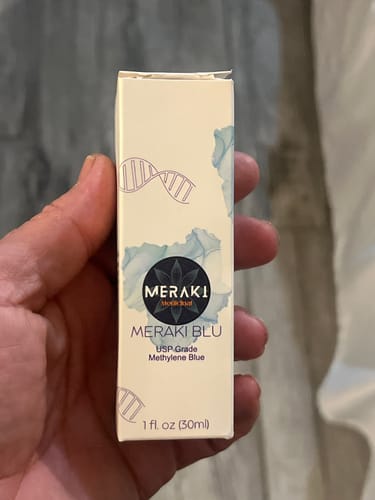 Customer holding the box for Meraki Blu USP Grade Methylene Blue.