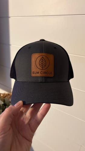 Customer photo review of Custom Leather Patch Trucker Hat - Flexfit 6511