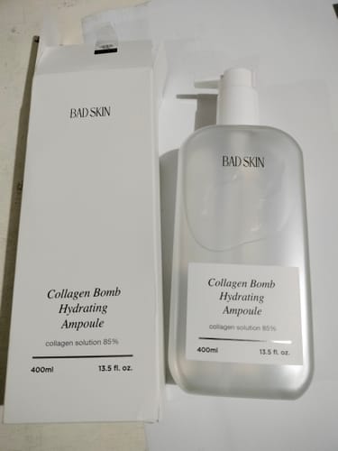 Customer's Bad Skin Collagen Bomb Hydrating Ampoule in a large pump bottle, next to its white box.