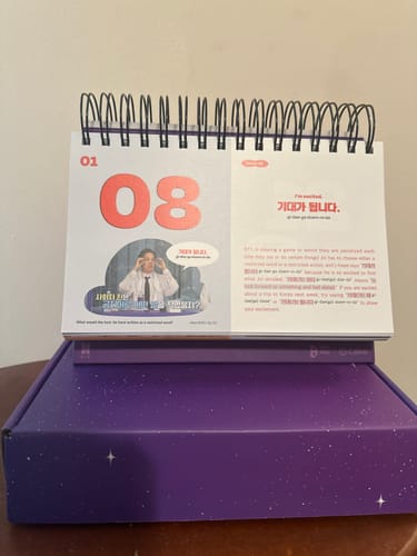 Customer's BTS - 365 BTS DAYS flip calendar standing upright on its purple, star-patterned box.