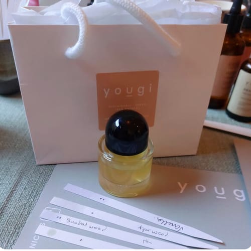 Reviewer's bespoke perfume from the Natural Perfume Making Masterclass, with handwritten scent strips and a branded bag.