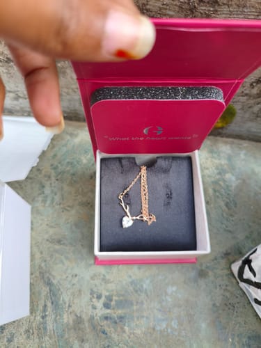 Customer opening the pink Wonderful Love Gift Box, showing a necklace placed inside.