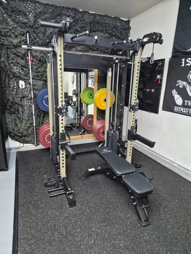 Customer's Major Fitness B52 All-In-One Home Gym machine in a garage gym with weight plates and a training bench.