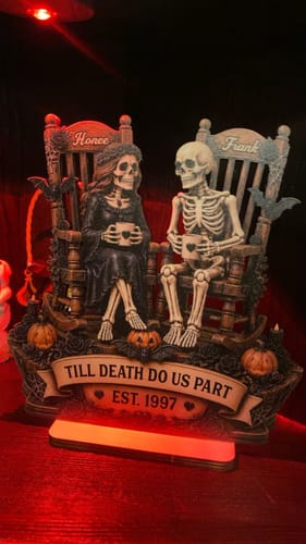 Customer's Till Death Do Us Part skeleton couple wooden plaque with personalized names and date on a dark surface.