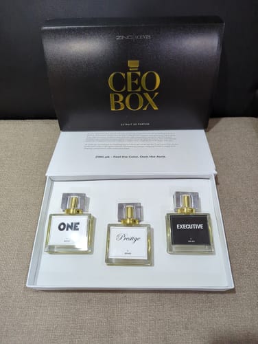 Customer's open CEO Box showing three glass perfume bottles labeled One, Prestige, and Executive inside white packaging