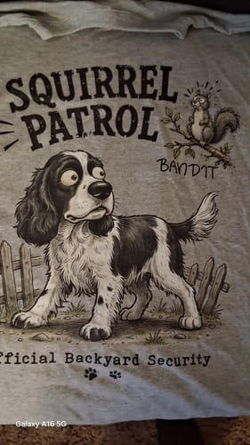 Customer's Squirrel Patrol shirt featuring a cartoon dog illustration and a squirrel perched on a tree branch.