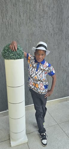 Customer photo review of Fabrosanz: Blue Nguni Print Golf Shirt-Kids