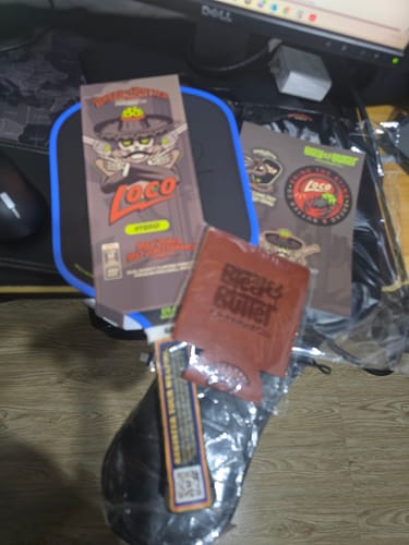 Customer's Bread and Butter Drink Cooler, Loco brand packaging, and stickers laid on a desk