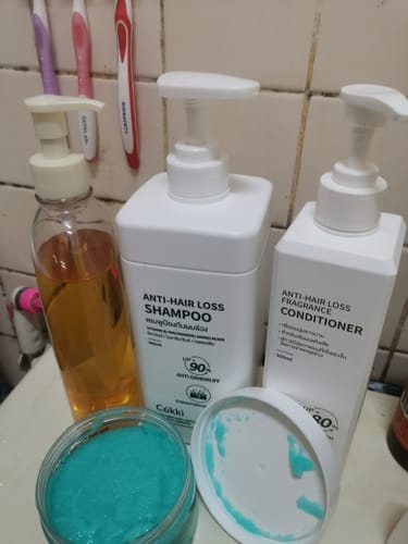 Customer photo review of ครีมนวดผมสูตรลดผมร่วง มีกลิ่นหอม 500 มล.
