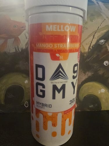 Customer's orange and white Mango Strawberry DELTA 9 GUMMIES HYBRID container standing upright.