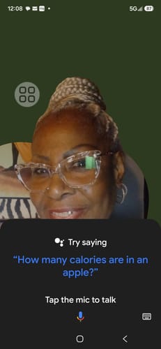 Reviewer's selfie, an older person wearing glasses looking at the camera, with a phone interface overlay.