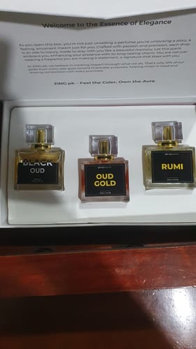 Customer's OUD Supreme Bundle gift box containing three glass perfume bottles labeled Black Oud, Oud Gold, and Rumi.