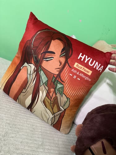 Customer's Alien Stage character cushion, featuring a Hyuna illustration on red fabric with music player graphics.