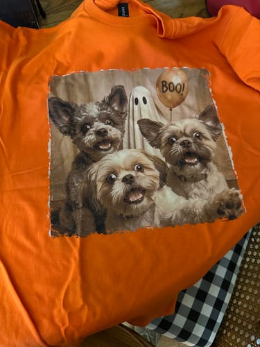 Customer's orange Custom Dog Cat Photo Halloween shirt featuring a printed graphic of three dogs and a ghostly balloon.