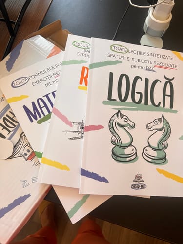 Customer's Pachet Bacalaureat books for Logica, Matematica, and Romana displayed on a table.