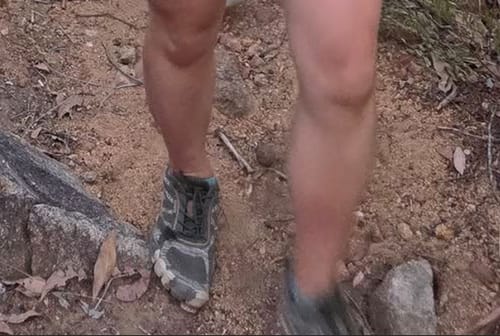 Close-up of a reviewer's Active II - Barefoot Shoes while walking on a rocky dirt trail.