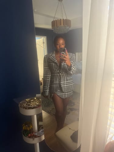 Reviewer taking a mirror selfie wearing the Houndstooth Plaid Suit Blazer styled as a dress, showing its long sleeves.
