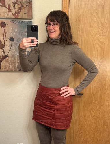 Reviewer showing the slim fit of the Peyton Turtleneck in Simply Taupe while taking a mirror selfie.