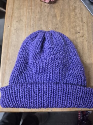 Customer's finished purple beanie, knitted with the soft Double Knit Acrylic Yarn.