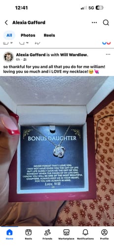 A reviewer holding open the "To My Bonus Daughter" Love Knot Gift Set in its illuminated box.