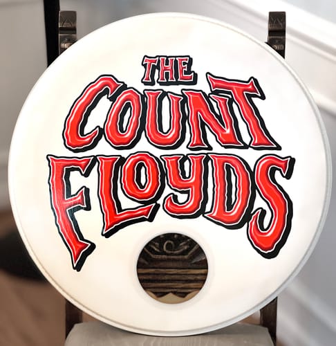 Customer's custom drumhead skin applied to a white drumhead, showing 'The Count Floyds' logo in red and black.