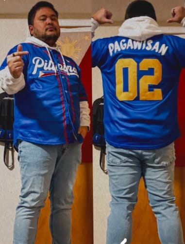 A reviewer showing the front and back of their custom blue Philippines Heritage Baseball Jersey in a split image.
