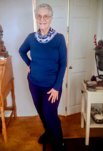 Reviewer wearing the Remi Long Sleeve T Shirt in Starry Night with a scarf and navy joggers.