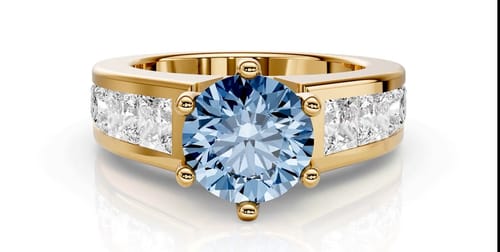Customer's fancy blue diamond ring with a thick gold band and channel-set princess cut side diamonds.