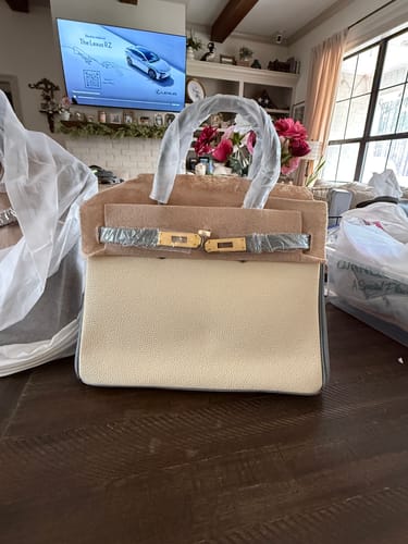 Customer's new LALUVA Warkin Bag on a table, partially unwrapped from its protective packaging.