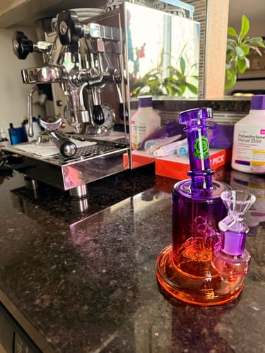 Customer's purple Ombre Glass Showerhead Percolator on a countertop next to an espresso machine.