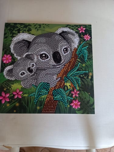 Customer's completed Koala Hugs Crystal Art Card showing a sparkly mother and baby koala.