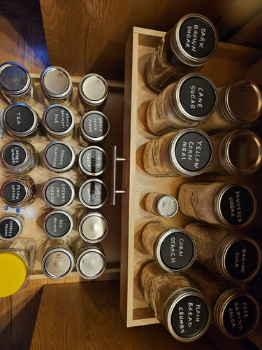 Customer's organized pantry drawer showing mason jars with handwritten Chalkboard Top Lids.