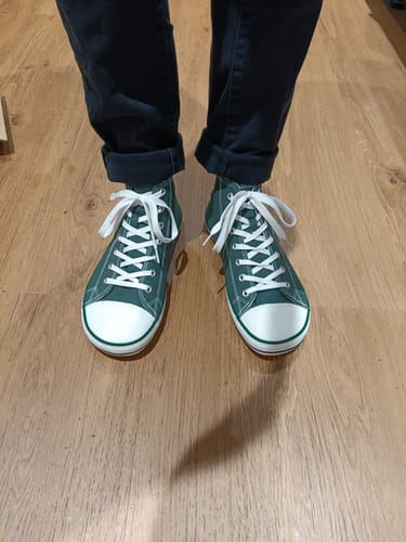 Customer wearing green, high-top Roam I - Barefoot Shoes, viewed from above.