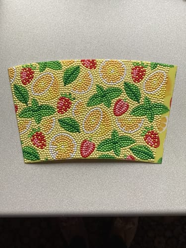 Customer's completed "Summer Fruits" Crystal Art template laid flat, showing a colorful, sparkling pattern of fruit and leaves.
