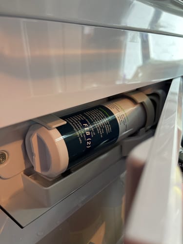 Customer's Glacierfresh XWFE Water Filter installed and fitting perfectly inside their refrigerator compartment.