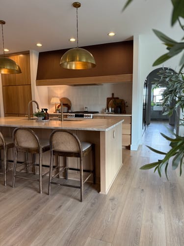 Reviewer's kitchen with Savile Row Wallpaper in Cocoa color applied to the range hood for a stylish accent.