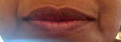 Close-up of a reviewer's smooth, moisturized lips after using LA LA LEAF lip balm.