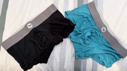 Customer's black and cyan Modal 3in Boxer Briefs with gray waistbands laid out side-by-side.