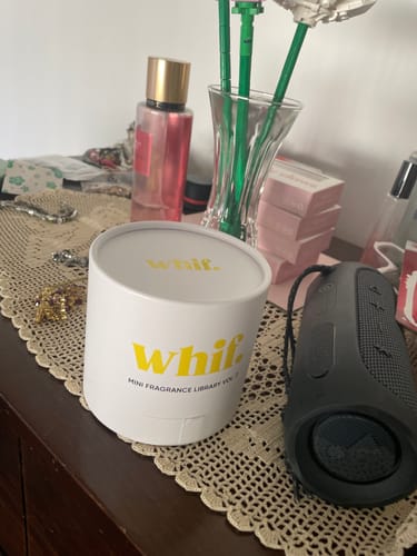 Customer's Fragrance Library Vol. 2 in its white cylindrical packaging on a dresser.