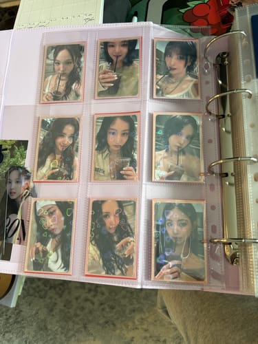 Customer's clear CUSTOM A4 POCKET PAGE in a binder, showcasing nine double-sleeved K-pop photocards.