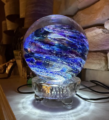 Customer's Lucite Light Stand illuminating a decorative glass orb with blue and purple swirls.