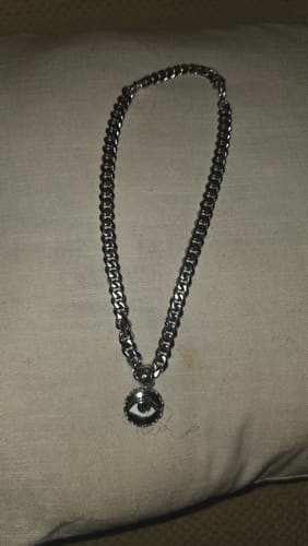 Customer's EVIL EYE PENDANT with a blue eye, on a thick silver chain.