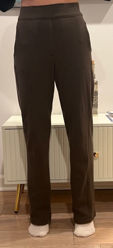 Customer wearing the brown Emerson Straight Leg Pants, showing the straight-leg fit from the front.