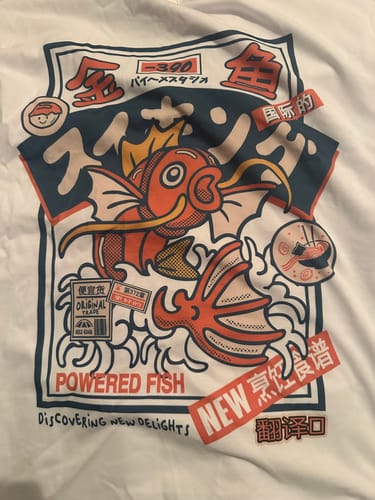 Customer's close-up of the vibrant, Japanese-style graphic on the white Koi King T-Shirt.