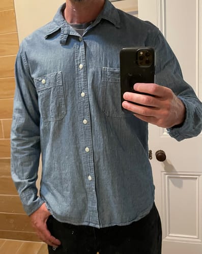 Customer wearing the Blue Chambray Work Shirt, showing the fit from the front.