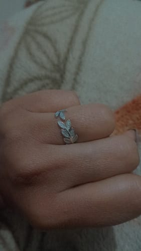 Close-up of a customer's hand wearing the Anushka Sharma Silver Zircon Leaf Ring.