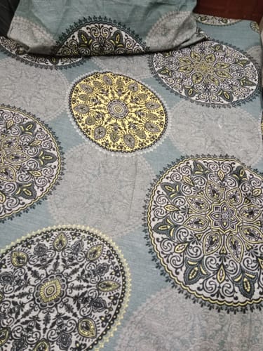 Customer's GORGE single bedsheet set showing the intricate mandala print in grey, yellow, and black.