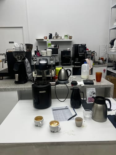 Customer's view of the coffee-making workstation for the Basic Barista Espresso Classes, showing equipment and finished coffees.