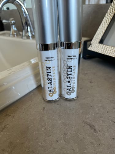 Customer's Alastin Renewal Retinol 0.25 and 0.5 bottles side-by-side on a bathroom countertop.